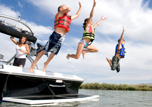 Kids Jumping Off Boat Into the Water
