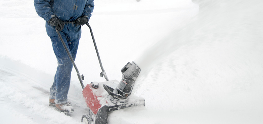 Man Snowblowing Driveway Safely