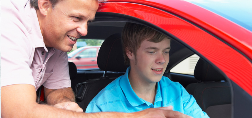 Father with Son Giving Driving Tips